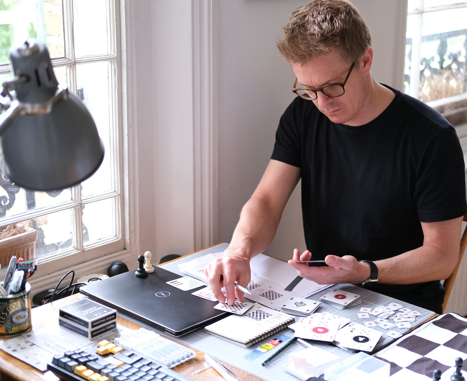 Rob at his desk doing card designery stuff