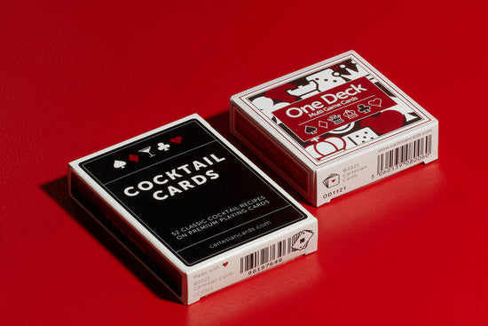 A deck of One Deck Games Cards and a deck Cocktail Cards playing cards by Cartesian Cards