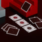 A deck of One Deck Game Cards playing cards laid out to play dominoes with red and grey geometric objects